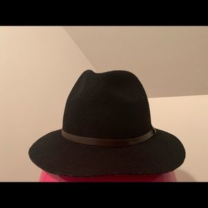 A black trilby hat